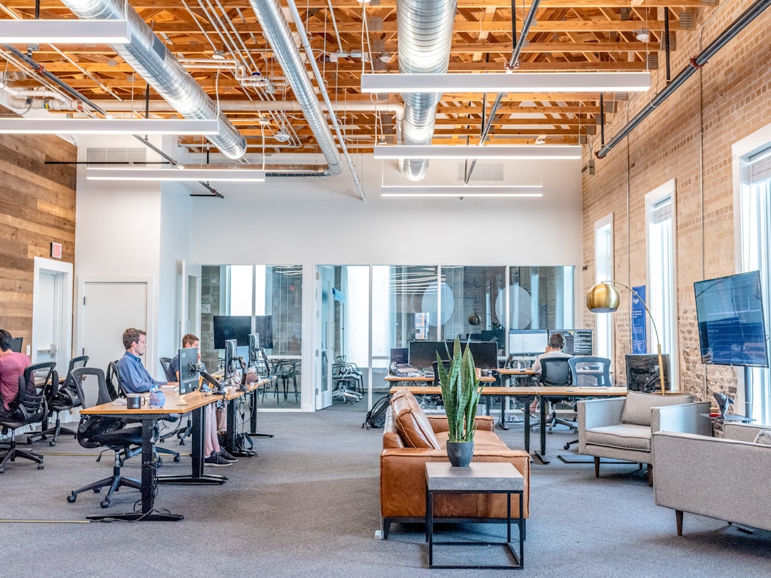 Bright open-plan office representing client-facing digital services