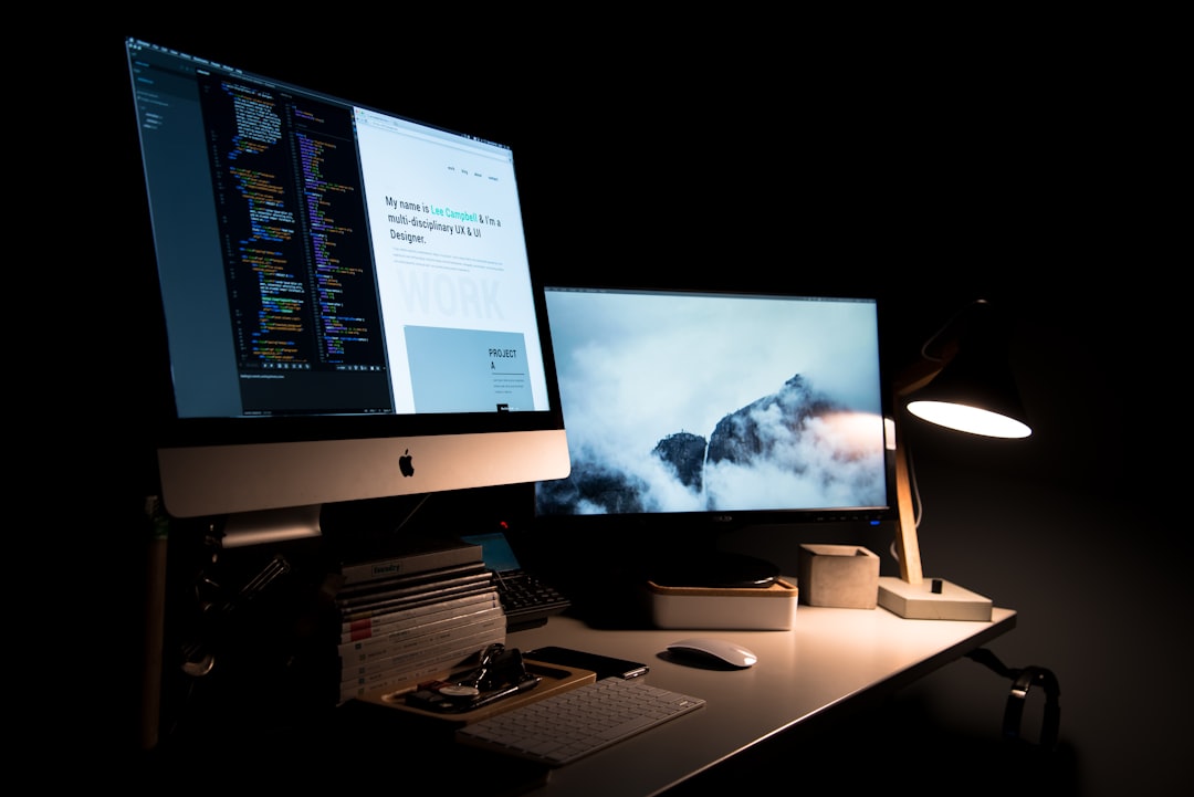Designer refining a website layout on screen