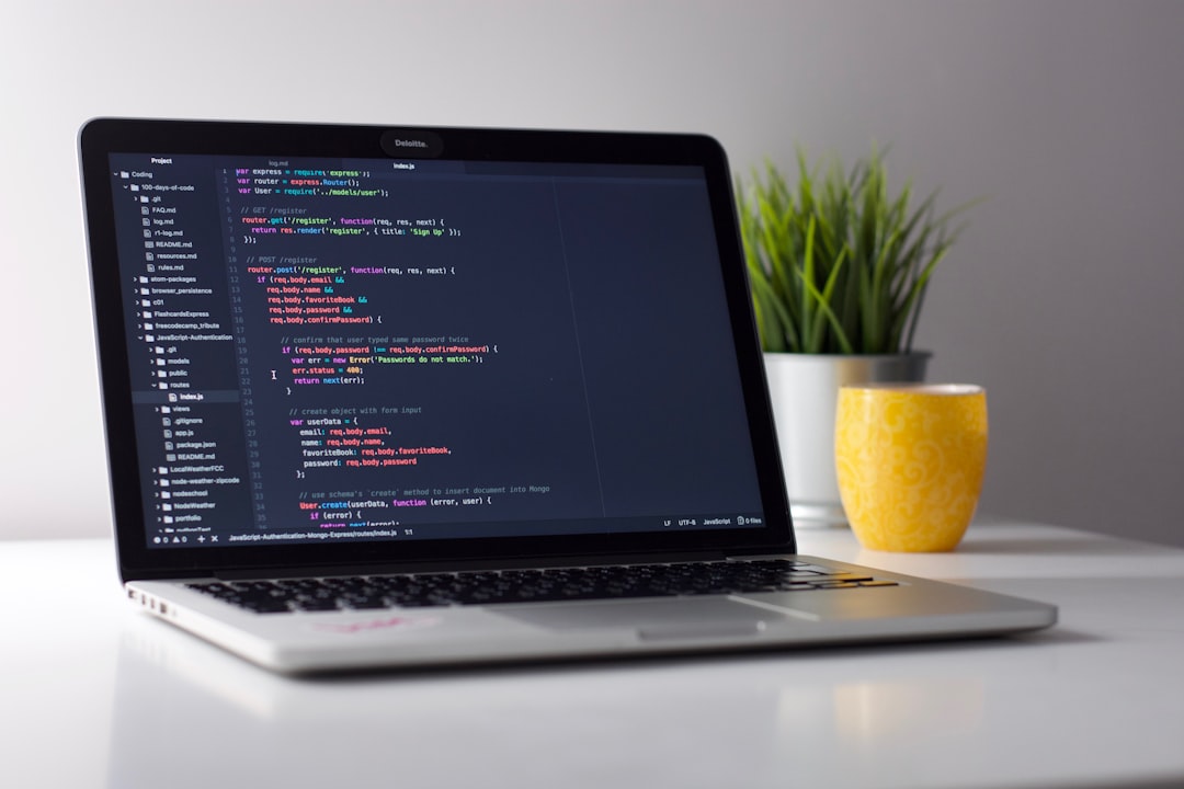 Developer reviewing code on multiple monitors